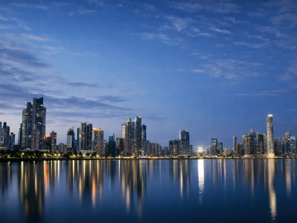 Luxury Panama City skyline at night with waterfront reflections