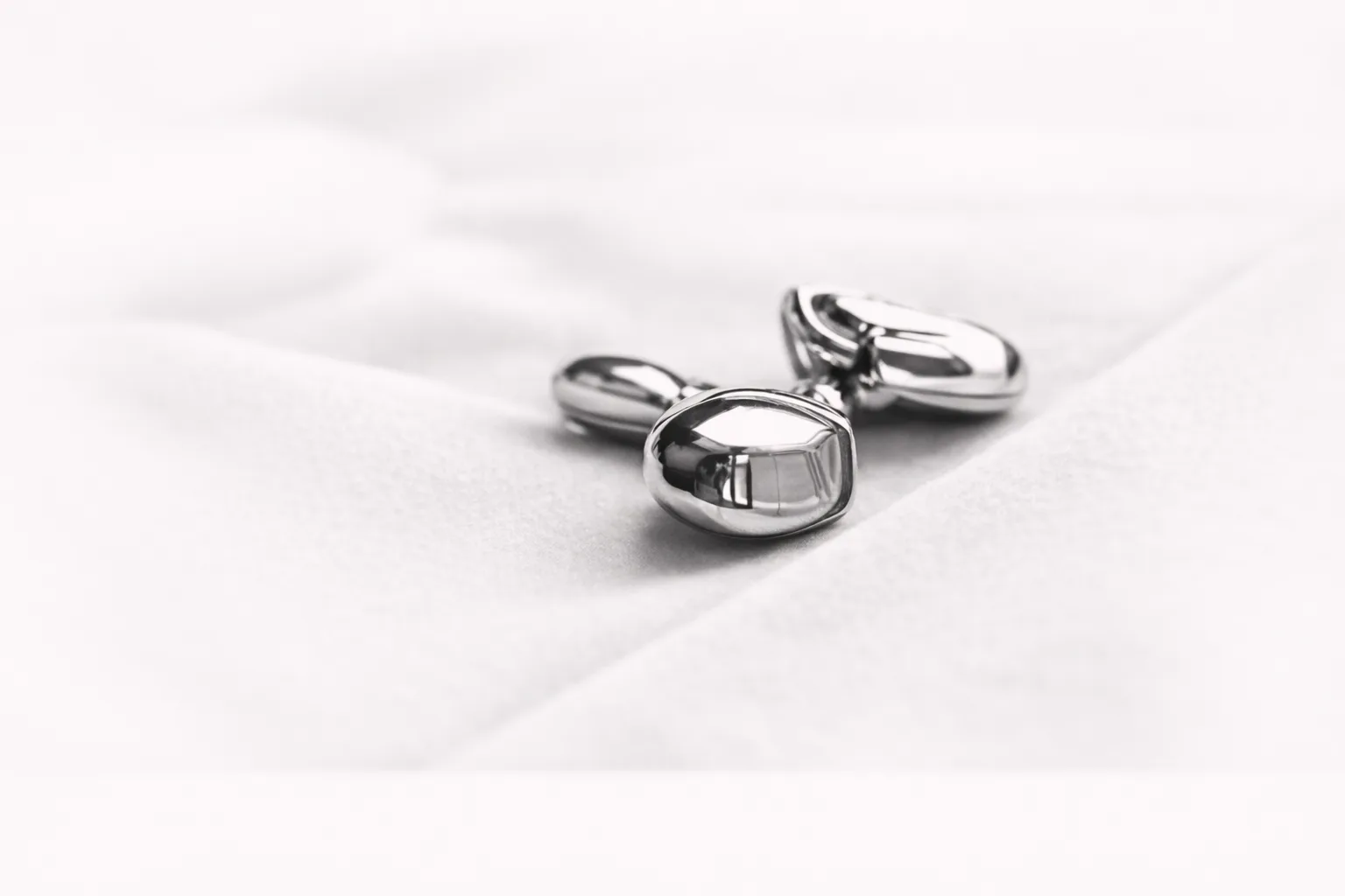 Luxury cufflinks on tailored fabric symbolising long-standing refinement and discretion
