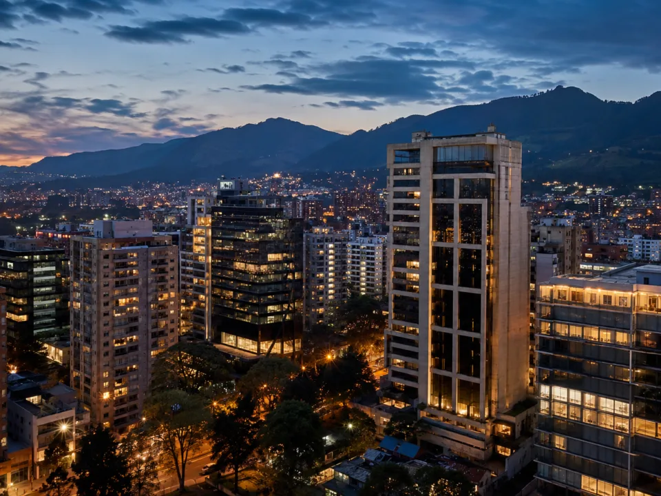 Bogotá skyline at dusk with the Andes mountains behind luxury high-rise buildings in the northern districts.